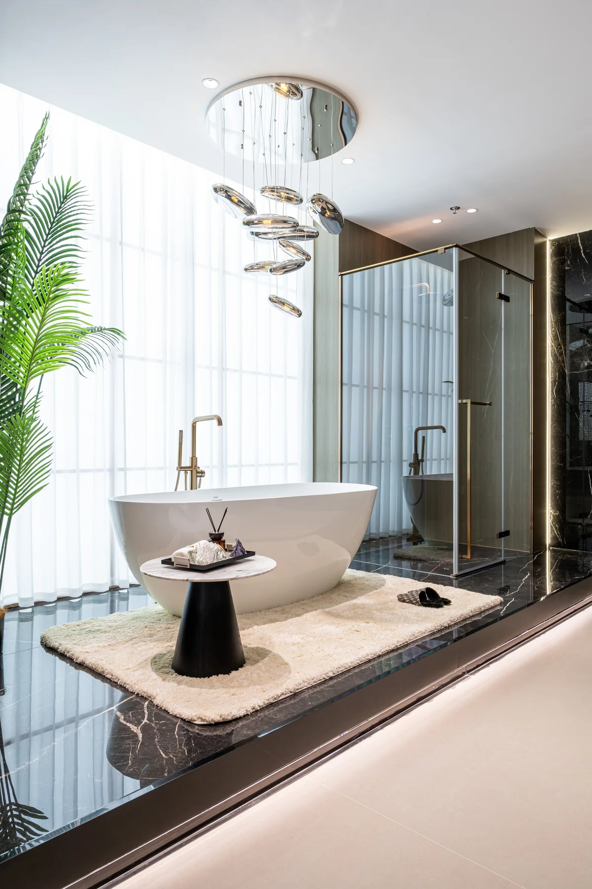 Shower enclosure beside a freestanding bathtub