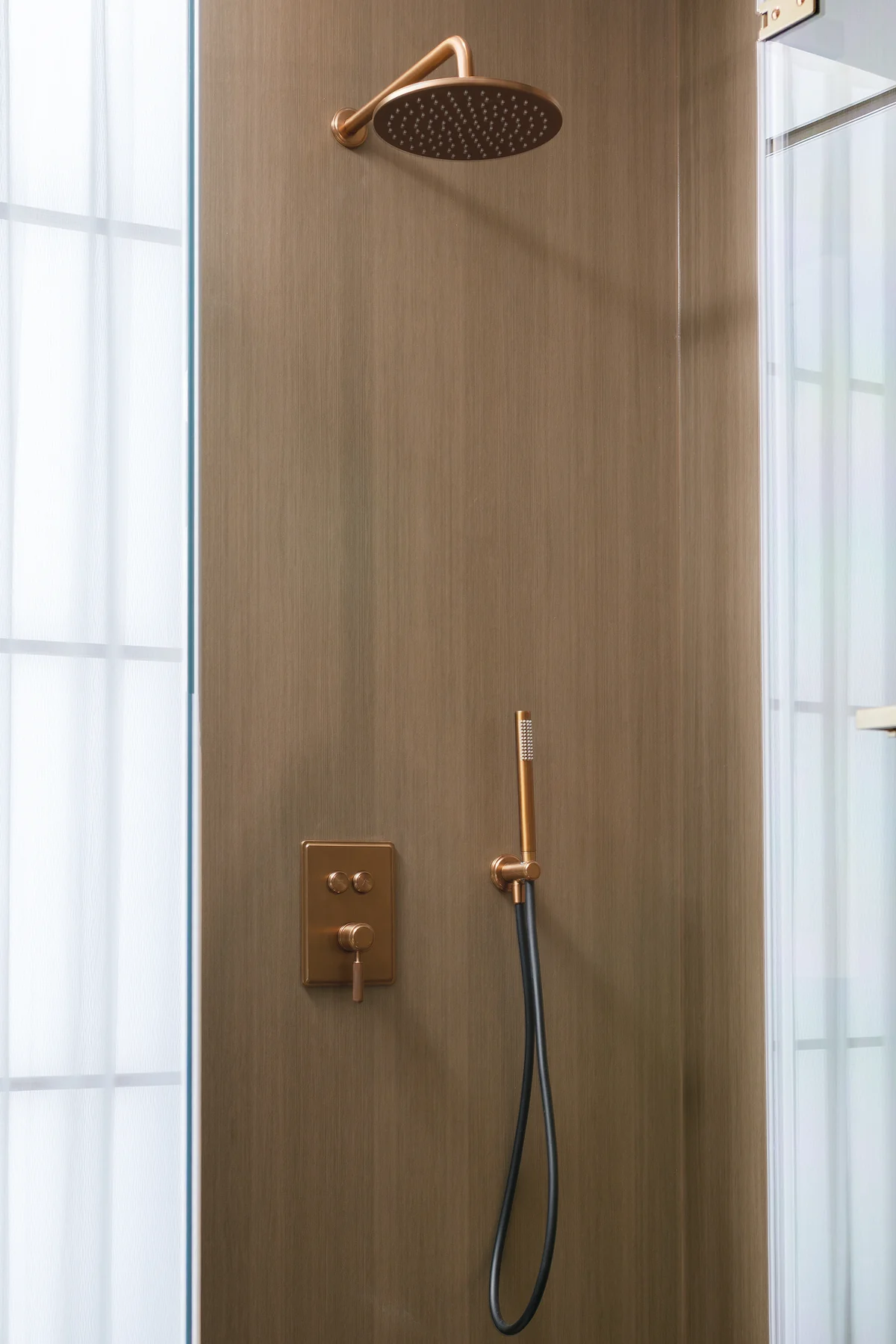 Brushed rose gold concealed shower system